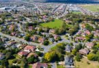 Aerial view of Canberra homes and green spaces.