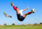 Soccer player executing a bicycle kick in action.