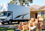 Moving truck parked outside a suburban Australian home.