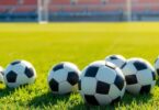 Different size soccer balls on a real Aussie pitch.