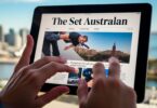 Newspaper on tablet, Perth skyline.