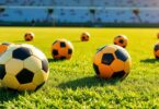Shiny soccer balls, vibrant colours, Aussie pitch.