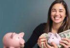 Person happily reviewing money with a balanced budget.