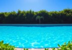 Sparkling clear swimming pool on a sunny day.