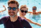 Adults swimming and smiling in a pool.