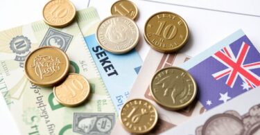 Australian coins and banknotes near a tax document.