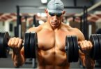 Swimmer lifting weights in a gym.