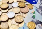 Australian dollar coins and banknotes scattered.