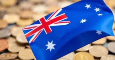 Australian flag with superimposed coins and tax document.