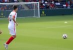 Soccer player in offside position near goal.