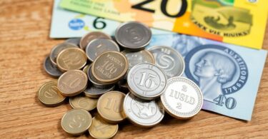 Australian coins and banknotes scattered on a table.