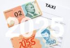 Australian flag with coins and tax documents.