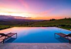 Luxury South Australian vineyard retreat infinity pool at sunset.