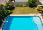 Australian backyard pool with visible plumbing and equipment