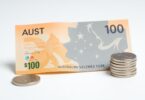 Australian $100 note and coins