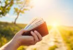 Happy person with overflowing wallet, bright future ahead.