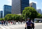 Melbourne street scene with people, police, and trams