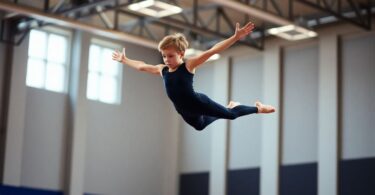 Gymnast in mid-air during a vault.
