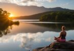 Person meditating by tranquil Australian lake