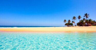 Australian beach with golden sand and blue water.