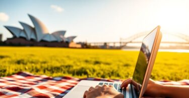 Person working on laptop with Australian landmarks.