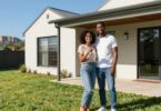 Couple holding keys outside a South Australian home.