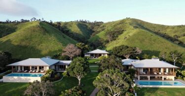Gaia Retreat Byron Bay aerial view, tranquil pools, lush hills.