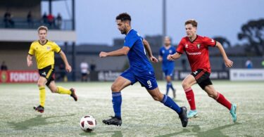 Fremantle 5-a-side football players in action on pitch.