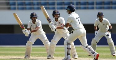 Young cricketers in action on a sunny field.