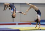 Gymnasts performing flips and tumbles at Gladesville Gymnastics Club.