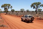 4x4 vehicle driving on dusty outback road