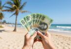 Australian dollars flying on a sunny beach.