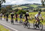 Cyclists riding on a scenic road in Melbourne.