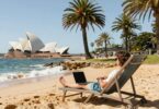 Australian beach with person earning passive income.