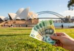 Australian dollars flying in front of Sydney Opera House.