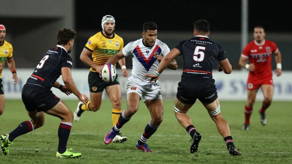 Rugby league players in action on a field.