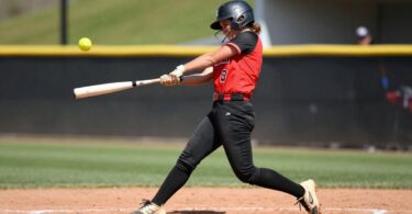 Softball player swinging bat at Penrith game.