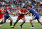 Rugby league players in action on the field.