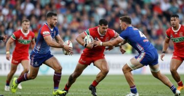 Rugby league players in action on the field.