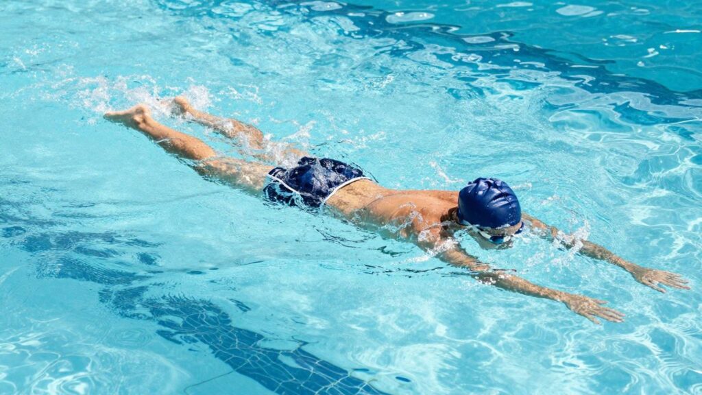 Beginner swimmer learning in Australian pool