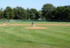 Baseball players on a sunny field at Surfers Paradise.