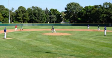 Baseball players on a sunny field at Surfers Paradise.