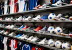 Sports gear and apparel neatly arranged in a shop.