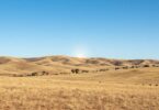 South Australian landscape with sunlit hills and blue sky.