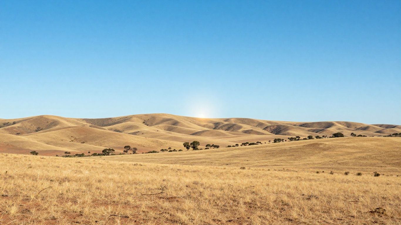 South Australian landscape with sunlit hills and blue sky.