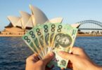 Australian dollars flying in front of Sydney Opera House.