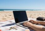 Australian beach with laptop, making money online.