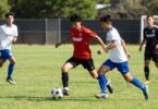Caloundra Soccer Club players in action on the field.