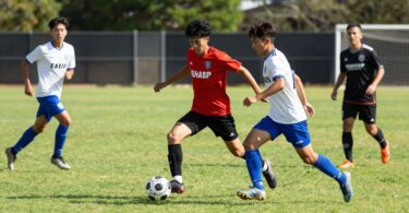 Caloundra Soccer Club players in action on the field.