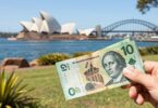 Australian money being held up in the sunshine.